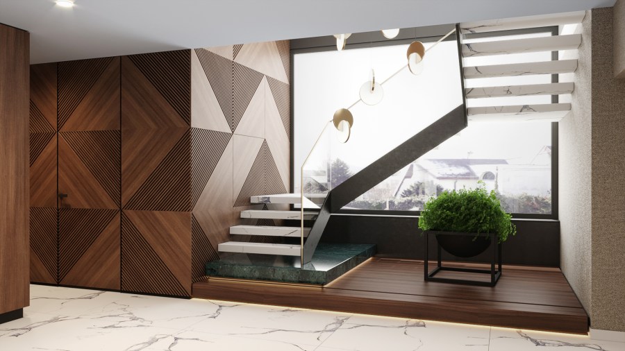 Az emeletre vezető impozáns lebegő lépcső falburkolat mögött gardróbhelyiség található